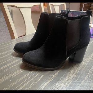 Heeled black booties